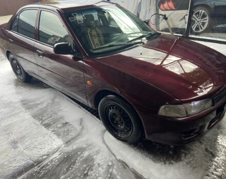 Красный Мицубиси Лансер, объемом двигателя 1.3 л и пробегом 275 тыс. км за 1500 $, фото 5 на Automoto.ua