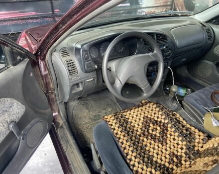 Червоний Міцубісі Lancer, об'ємом двигуна 1.3 л та пробігом 275 тис. км за 1500 $, фото 7 на Automoto.ua