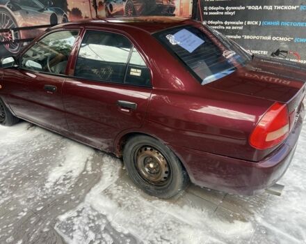 Червоний Міцубісі Lancer, об'ємом двигуна 1.3 л та пробігом 275 тис. км за 1500 $, фото 6 на Automoto.ua
