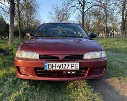 Красный Мицубиси Лансер, объемом двигателя 1.3 л и пробегом 182 тыс. км за 3000 $, фото 1 на Automoto.ua