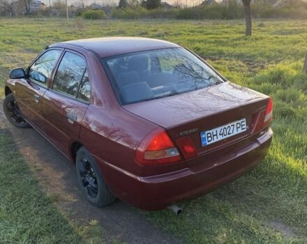 Красный Мицубиси Лансер, объемом двигателя 1.3 л и пробегом 182 тыс. км за 3000 $, фото 3 на Automoto.ua