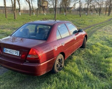 Красный Мицубиси Лансер, объемом двигателя 1.3 л и пробегом 182 тыс. км за 3000 $, фото 4 на Automoto.ua