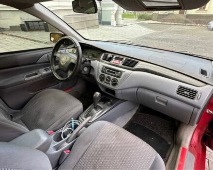 Красный Мицубиси Лансер, объемом двигателя 2 л и пробегом 350 тыс. км за 3399 $, фото 4 на Automoto.ua