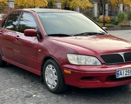 Красный Мицубиси Лансер, объемом двигателя 2 л и пробегом 350 тыс. км за 3399 $, фото 1 на Automoto.ua