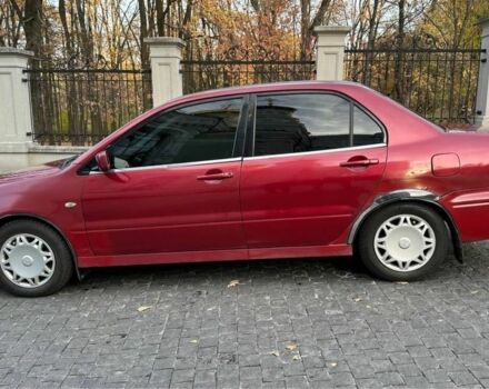 Красный Мицубиси Лансер, объемом двигателя 2 л и пробегом 350 тыс. км за 3399 $, фото 3 на Automoto.ua