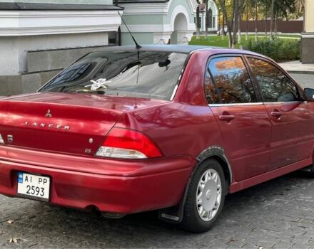 Красный Мицубиси Лансер, объемом двигателя 2 л и пробегом 350 тыс. км за 3399 $, фото 2 на Automoto.ua