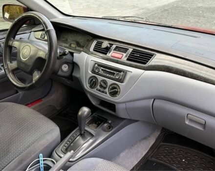 Красный Мицубиси Лансер, объемом двигателя 2 л и пробегом 350 тыс. км за 3399 $, фото 7 на Automoto.ua