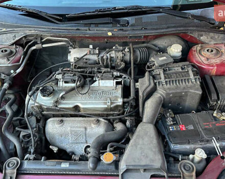 Красный Мицубиси Лансер, объемом двигателя 2 л и пробегом 202 тыс. км за 2599 $, фото 9 на Automoto.ua