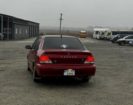 Красный Мицубиси Лансер, объемом двигателя 2 л и пробегом 202 тыс. км за 2599 $, фото 3 на Automoto.ua