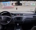 Красный Мицубиси Лансер, объемом двигателя 2 л и пробегом 219 тыс. км за 3800 $, фото 1 на Automoto.ua