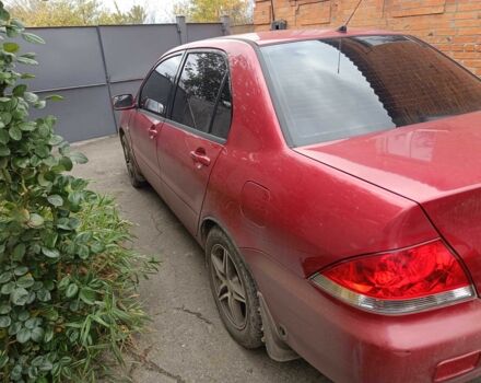 Міцубісі Lancer 2003 у Харкові на Automoto.ua Червоний Міцубісі Lancer, об'ємом двигуна 1.6 л та пробігом 302 тис. км за 3800 $, фото 12 на Automoto.ua