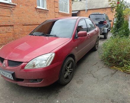 Міцубісі Lancer 2003 у Харкові на Automoto.ua Червоний Міцубісі Lancer, об'ємом двигуна 1.6 л та пробігом 302 тис. км за 3800 $, фото 11 на Automoto.ua