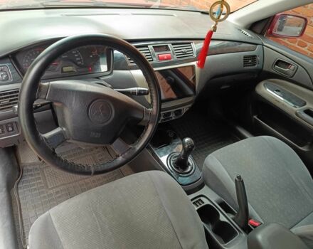 Міцубісі Lancer 2003 у Харкові на Automoto.ua Червоний Міцубісі Lancer, об'ємом двигуна 1.6 л та пробігом 302 тис. км за 3800 $, фото 9 на Automoto.ua