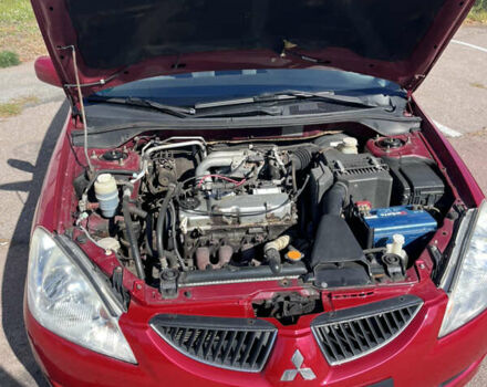 Червоний Міцубісі Lancer, об'ємом двигуна 1.58 л та пробігом 300 тис. км за 3200 $, фото 5 на Automoto.ua