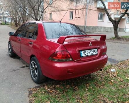 Червоний Міцубісі Lancer, об'ємом двигуна 1.3 л та пробігом 223 тис. км за 4250 $, фото 14 на Automoto.ua