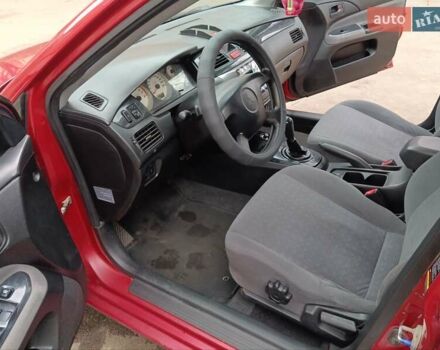 Червоний Міцубісі Lancer, об'ємом двигуна 1.3 л та пробігом 223 тис. км за 4250 $, фото 36 на Automoto.ua