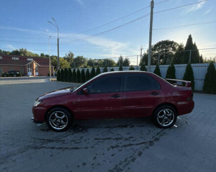 Червоний Міцубісі Lancer, об'ємом двигуна 1.3 л та пробігом 219 тис. км за 3600 $, фото 1 на Automoto.ua
