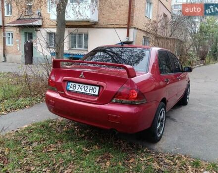 Червоний Міцубісі Lancer, об'ємом двигуна 1.3 л та пробігом 223 тис. км за 4250 $, фото 13 на Automoto.ua