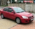 Красный Мицубиси Лансер, объемом двигателя 1.6 л и пробегом 273 тыс. км за 4800 $, фото 1 на Automoto.ua