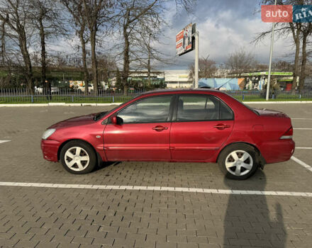 Червоний Міцубісі Lancer, об'ємом двигуна 1.58 л та пробігом 271 тис. км за 4100 $, фото 1 на Automoto.ua