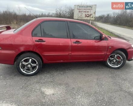 Красный Мицубиси Лансер, объемом двигателя 1.3 л и пробегом 250 тыс. км за 3450 $, фото 4 на Automoto.ua
