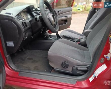 Червоний Міцубісі Lancer, об'ємом двигуна 1.3 л та пробігом 223 тис. км за 4250 $, фото 34 на Automoto.ua