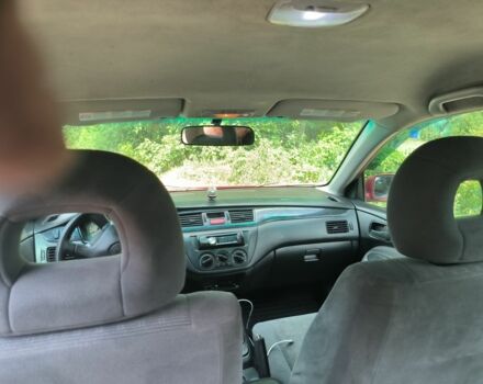 Красный Мицубиси Лансер, объемом двигателя 1 л и пробегом 2 тыс. км за 3100 $, фото 1 на Automoto.ua