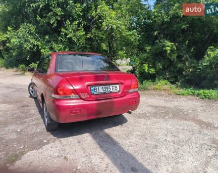 Красный Мицубиси Лансер, объемом двигателя 1.6 л и пробегом 400 тыс. км за 3100 $, фото 4 на Automoto.ua