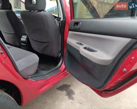 Червоний Міцубісі Lancer, об'ємом двигуна 1.3 л та пробігом 223 тис. км за 4250 $, фото 28 на Automoto.ua