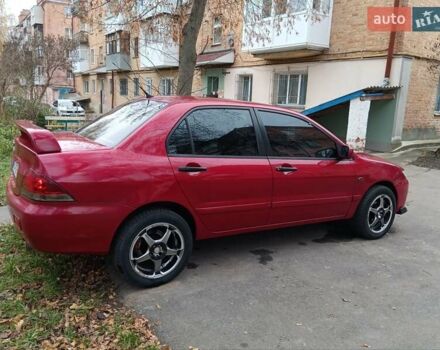Червоний Міцубісі Lancer, об'ємом двигуна 1.3 л та пробігом 223 тис. км за 4250 $, фото 9 на Automoto.ua