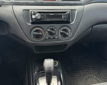 Червоний Міцубісі Lancer, об'ємом двигуна 1.58 л та пробігом 271 тис. км за 4100 $, фото 10 на Automoto.ua