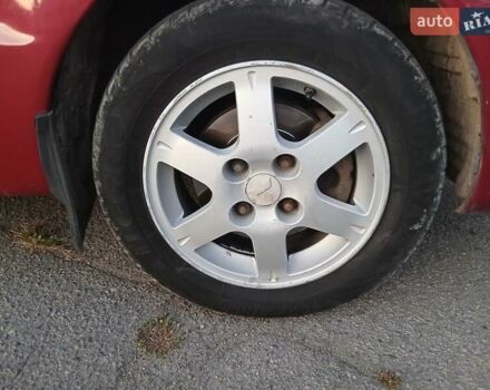 Красный Мицубиси Лансер, объемом двигателя 1.58 л и пробегом 250 тыс. км за 2999 $, фото 2 на Automoto.ua