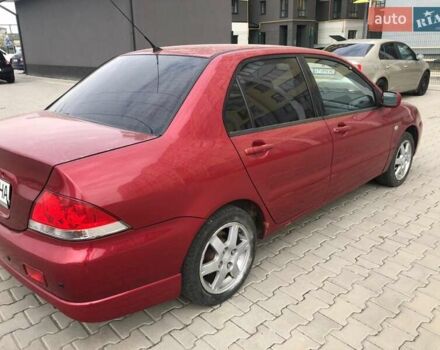 Красный Мицубиси Лансер, объемом двигателя 1.6 л и пробегом 224 тыс. км за 5500 $, фото 1 на Automoto.ua