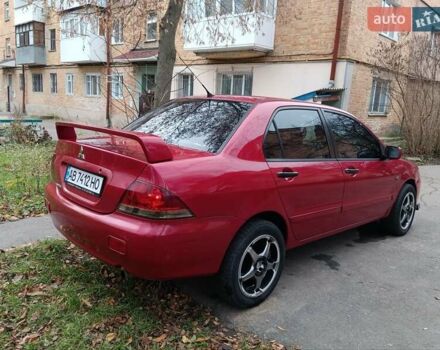Червоний Міцубісі Lancer, об'ємом двигуна 1.3 л та пробігом 223 тис. км за 4250 $, фото 12 на Automoto.ua