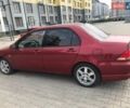 Красный Мицубиси Лансер, объемом двигателя 1.6 л и пробегом 224 тыс. км за 5500 $, фото 3 на Automoto.ua