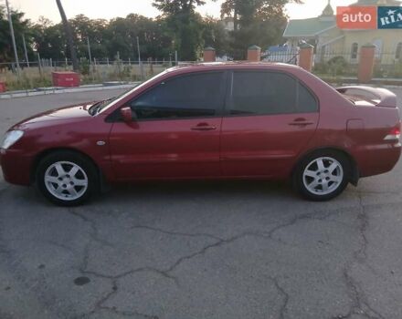 Красный Мицубиси Лансер, объемом двигателя 1.58 л и пробегом 250 тыс. км за 2999 $, фото 5 на Automoto.ua