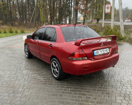Червоний Міцубісі Lancer, об'ємом двигуна 1.58 л та пробігом 350 тис. км за 3600 $, фото 3 на Automoto.ua