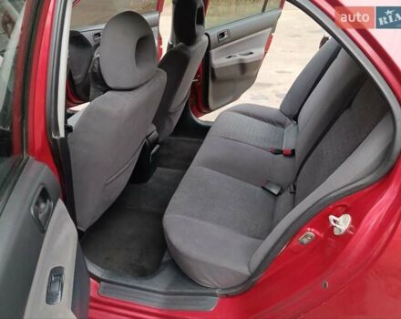 Червоний Міцубісі Lancer, об'ємом двигуна 1.3 л та пробігом 223 тис. км за 4250 $, фото 33 на Automoto.ua