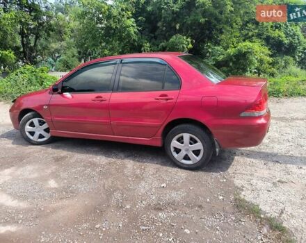 Красный Мицубиси Лансер, объемом двигателя 1.6 л и пробегом 400 тыс. км за 3100 $, фото 2 на Automoto.ua