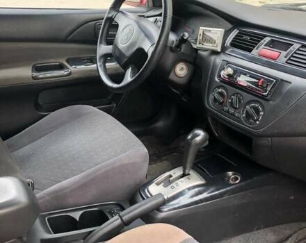 Красный Мицубиси Лансер, объемом двигателя 1.6 л и пробегом 224 тыс. км за 5500 $, фото 5 на Automoto.ua