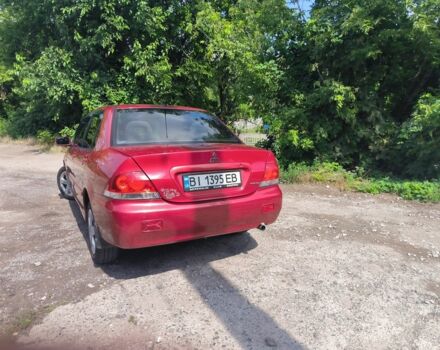 Красный Мицубиси Лансер, объемом двигателя 1 л и пробегом 2 тыс. км за 3100 $, фото 5 на Automoto.ua