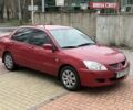 Красный Мицубиси Лансер, объемом двигателя 1.6 л и пробегом 273 тыс. км за 4900 $, фото 1 на Automoto.ua
