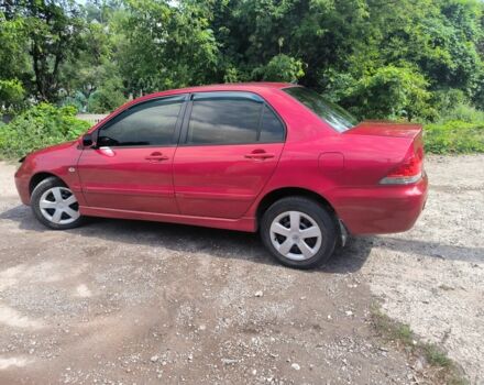 Красный Мицубиси Лансер, объемом двигателя 1 л и пробегом 2 тыс. км за 3100 $, фото 3 на Automoto.ua