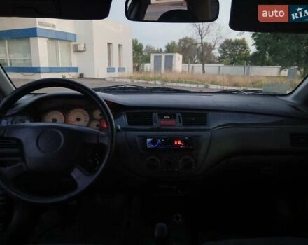 Красный Мицубиси Лансер, объемом двигателя 1.58 л и пробегом 250 тыс. км за 2999 $, фото 10 на Automoto.ua