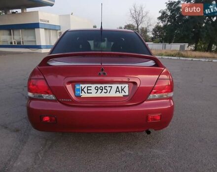 Красный Мицубиси Лансер, объемом двигателя 1.58 л и пробегом 250 тыс. км за 2999 $, фото 3 на Automoto.ua