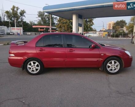 Красный Мицубиси Лансер, объемом двигателя 1.58 л и пробегом 250 тыс. км за 2999 $, фото 7 на Automoto.ua