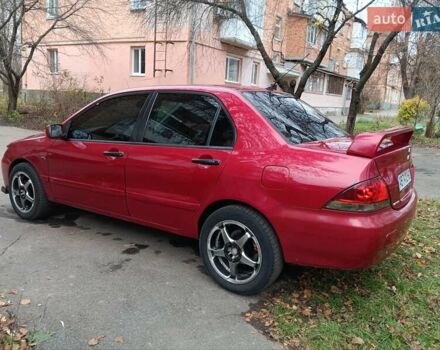 Червоний Міцубісі Lancer, об'ємом двигуна 1.3 л та пробігом 223 тис. км за 4250 $, фото 16 на Automoto.ua