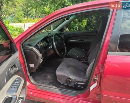 Красный Мицубиси Лансер, объемом двигателя 1.6 л и пробегом 400 тыс. км за 3100 $, фото 7 на Automoto.ua