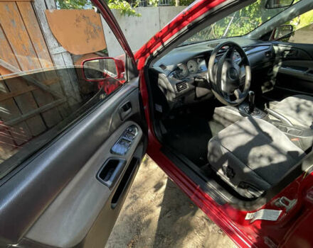 Червоний Міцубісі Lancer, об'ємом двигуна 1.3 л та пробігом 219 тис. км за 3600 $, фото 6 на Automoto.ua