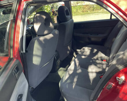 Червоний Міцубісі Lancer, об'ємом двигуна 1.3 л та пробігом 219 тис. км за 3600 $, фото 7 на Automoto.ua